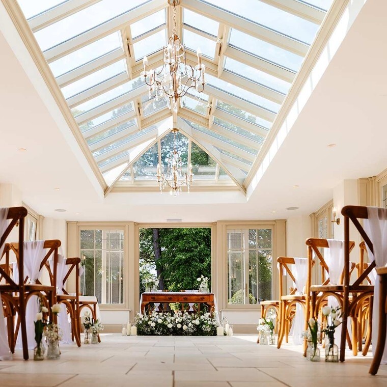 An aisle setup and ready for a couple at a Northamptonshire manor house wedding venue