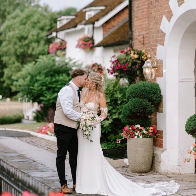 Couple in from of Arrow Mill Wedding Venue in Warwickshire