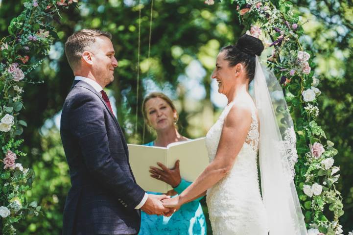 Celebrant Sam with bride and groom at woodland wedding