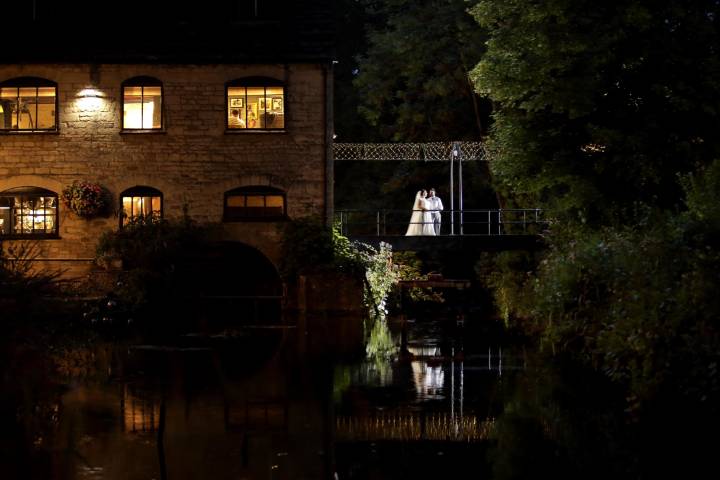 Egypt Mill at night with bride and groom on bridge