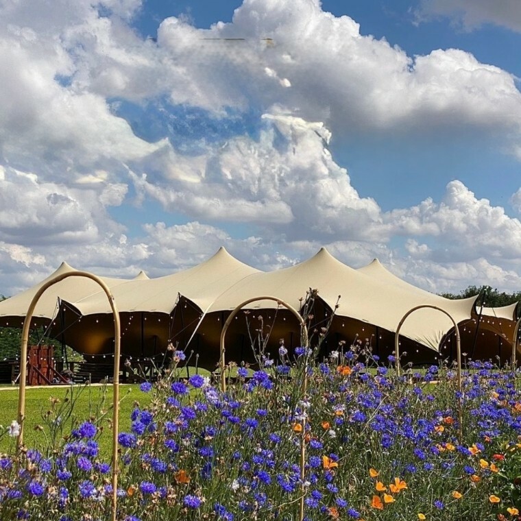 Stretch tent with flowers at Mill Farm 