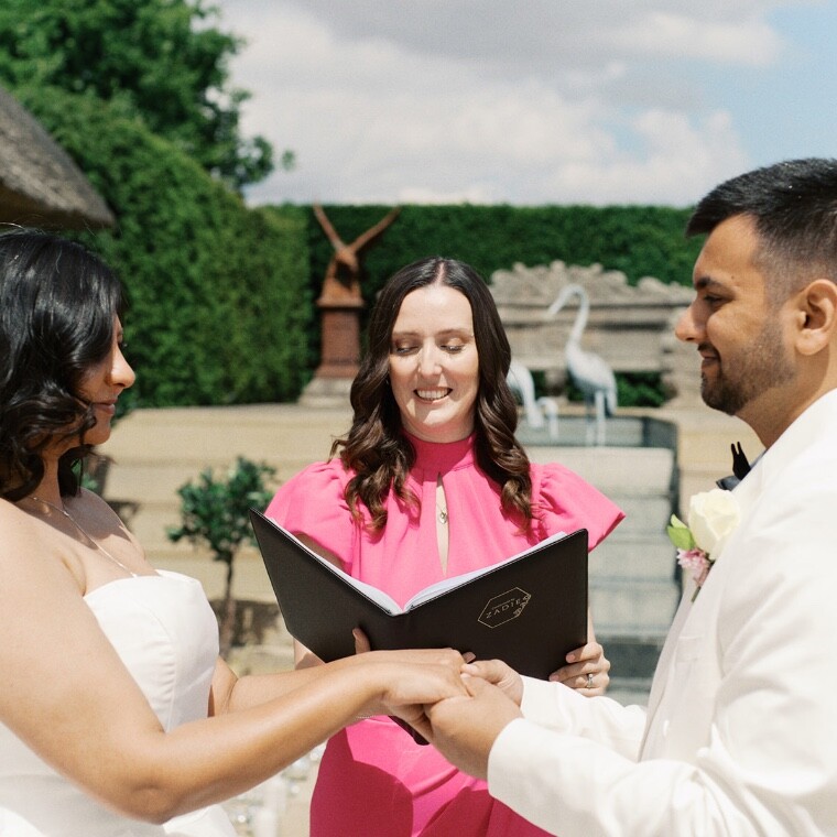 UK Wedding Celebrant with couple holding hands in wedding ceremony 