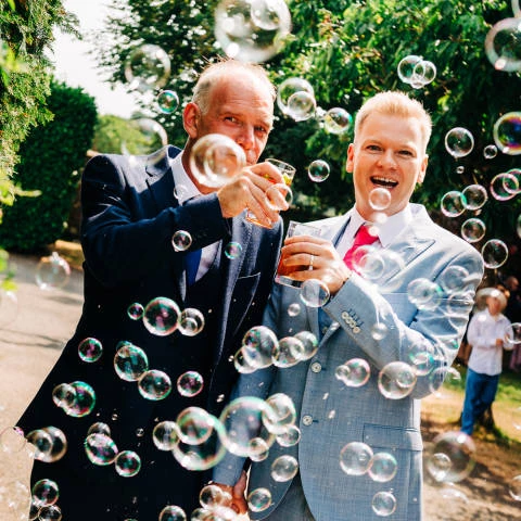 Two men surrounded by bubbles