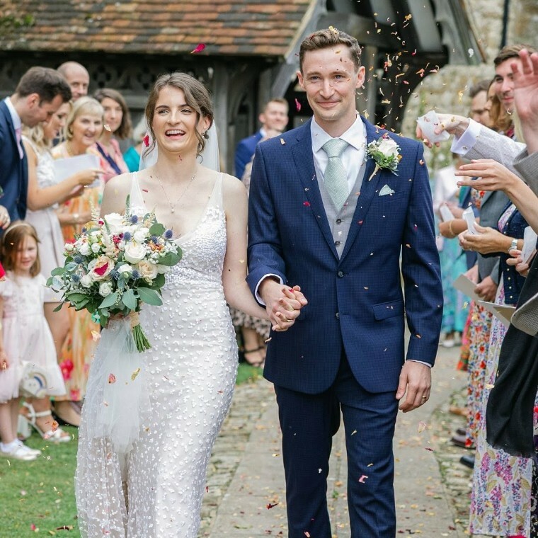 Bride and groom holding hands