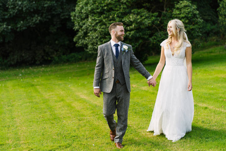 Bride and groom holding hands