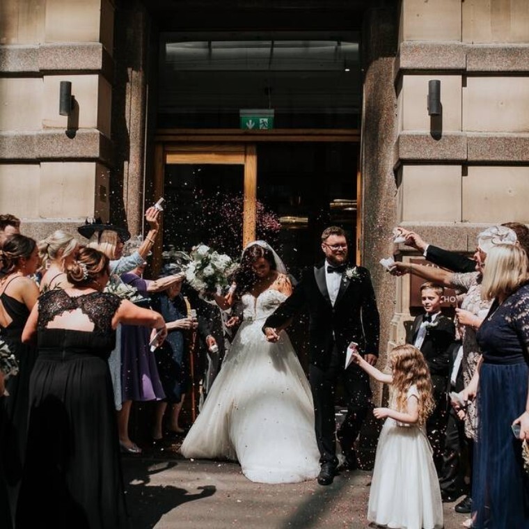 Bride and Groom leaving King Street Townhouse - wedding venue manchester