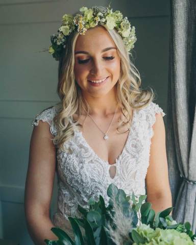 Stunning bride holding bouquet