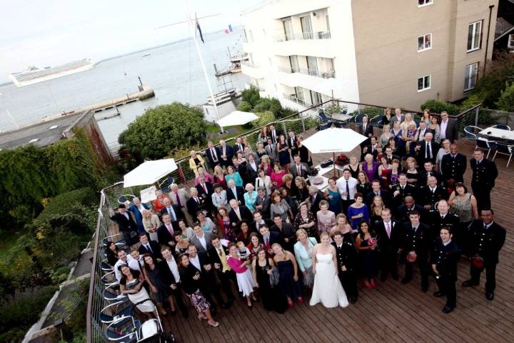 Wedding guests drone shot roof top