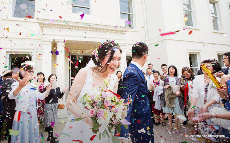Celebrations and confetti for a couple who have married at Morden Hall in London