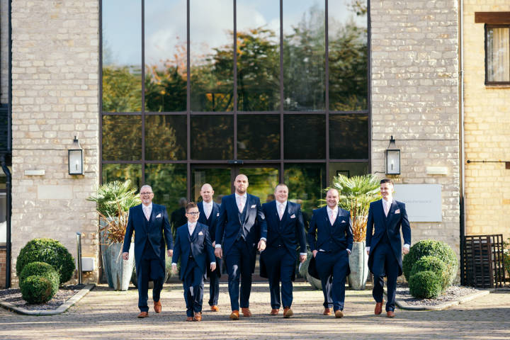 Groomsmen at Hotel Entrance