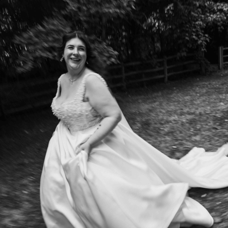 Bride running with her dress