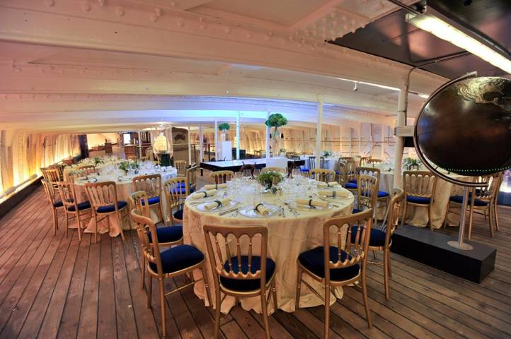 Cutty Sark, tween deck, intimate dinner setup with round tables 