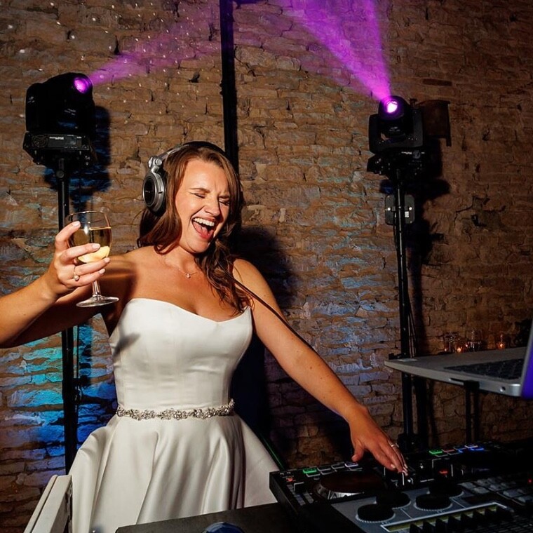 Bride taking on the DJ deck 