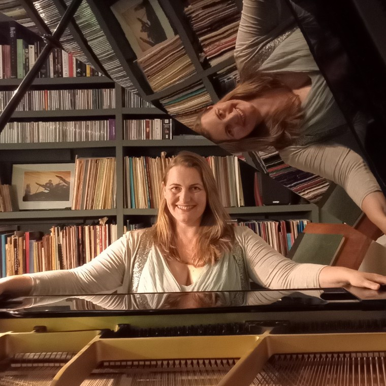 Olivia Rose, pianist, at her piano in her Oxfordshire music studio. 