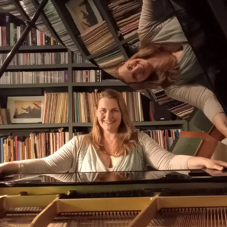 Olivia Rose, pianist, at her piano in her Oxfordshire music studio. 