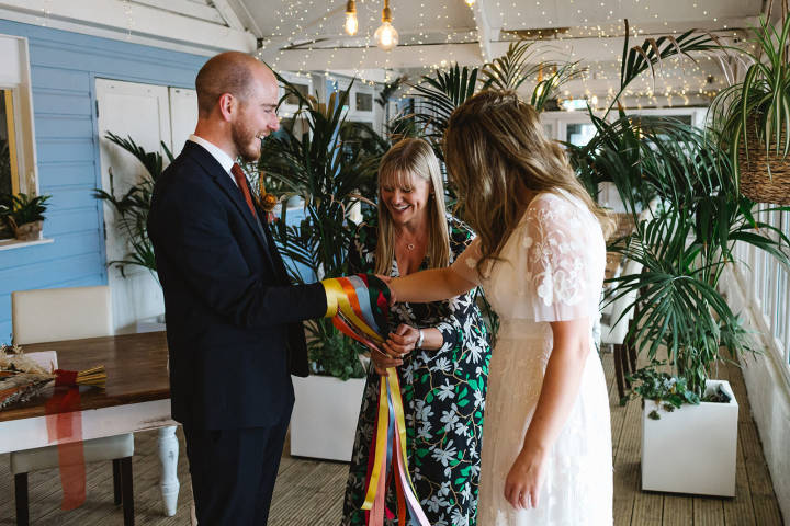 Celebrant Lisa with bride and groom at Lusty Glaze