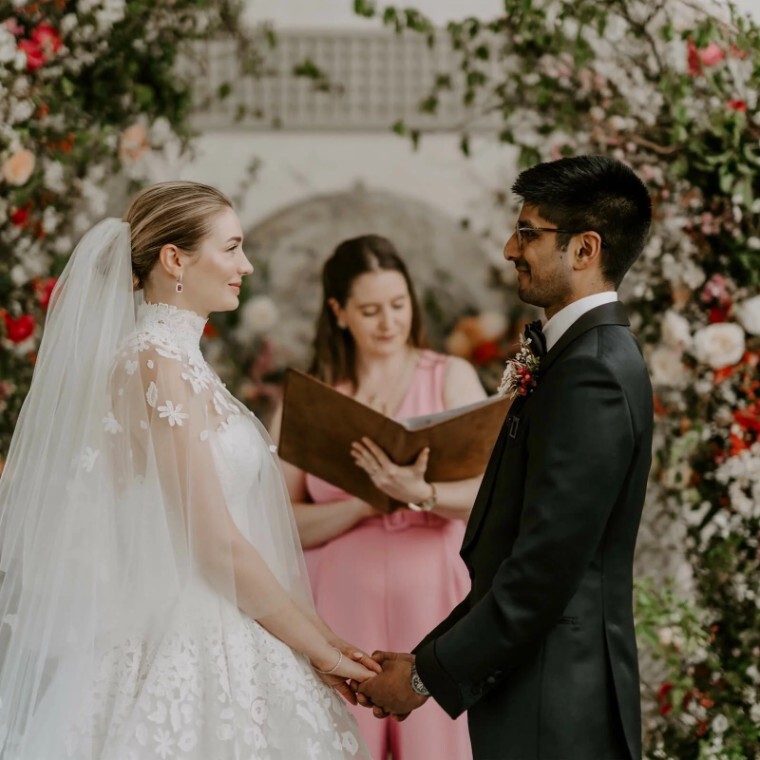 Celebrant officiating Ceremony between soon to be husband and wife.