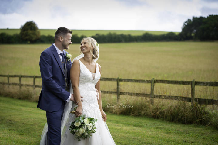 Stone Photos Wedding Photographer in Berkshire, Buckinghamshire, Surrey, Bride, Relaxed, natural, candid, Groom, Love, Couple, Portraits, field, Clock House Barn