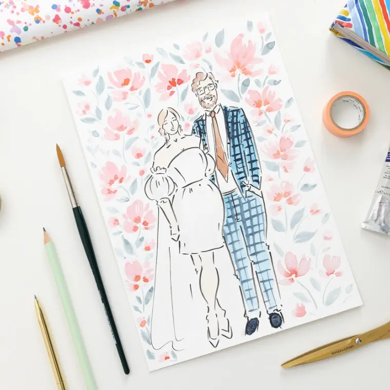Photo of an illustrated bride and groom, surrounded by pink painted flowers.  The bride is wearing a short white dress with puff skeeves and a veil and the groom is wearing a blue check suit.