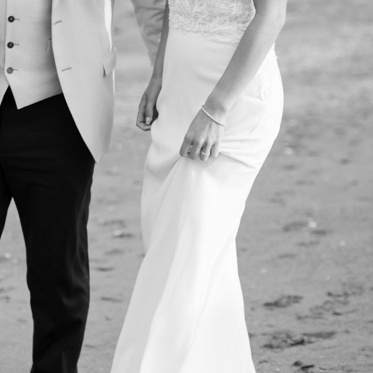 Black and white photo of a couple on a beach 