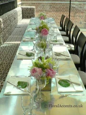 Peonies, sweet peas and alchemilla in mirror cubes - by Floral Accents.