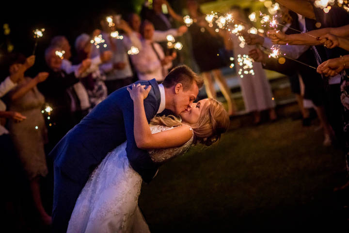 The Great Barn, barn wedding venue Oxfordshire - sparklers, first kiss