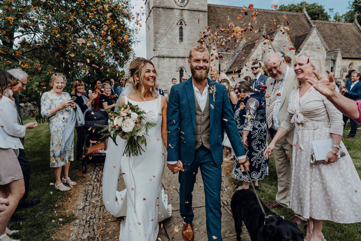 A bride and Groom in Confetti at Bladon Church