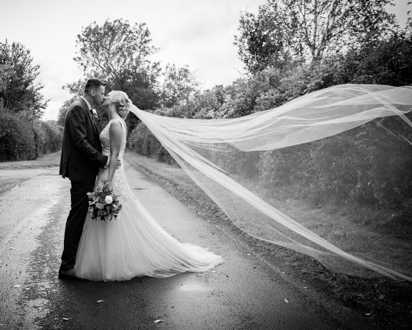 Stone Photos Wedding Photographer in Berkshire, Buckinghamshire, Surrey, Bride, Relaxed, natural, candid, Groom, Love, Couple, Portraits, Veil, Kiss, Clockhouse Barn