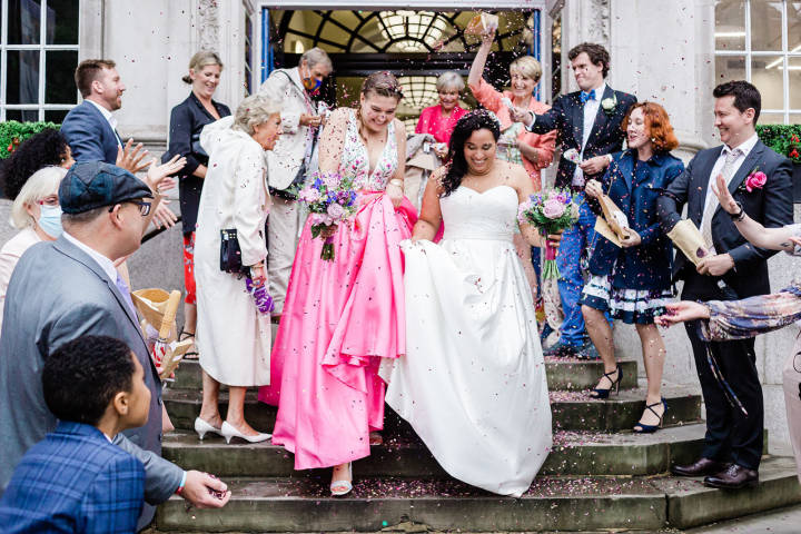 Brides exiting Chelsea Old Town Hall in confetti shower