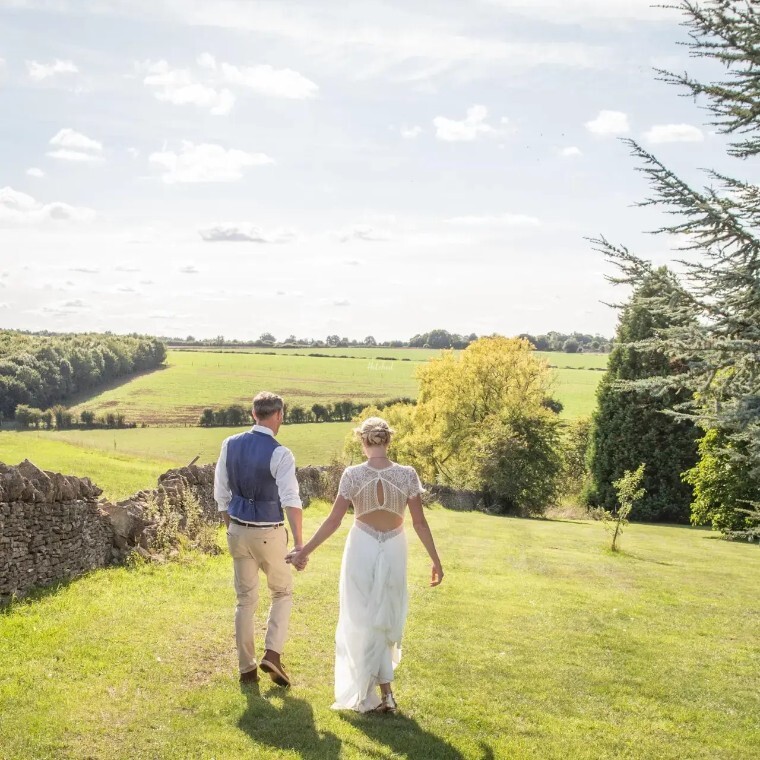 Bride and groom enjoying a countryside wedding celebration at a scenic UK wedding venue with panoramic views and beautiful outdoor surroundings