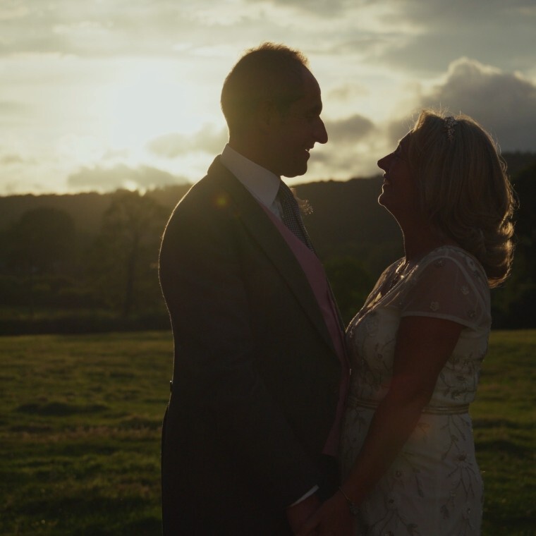 Recently Married Couple Backlit by Sunset