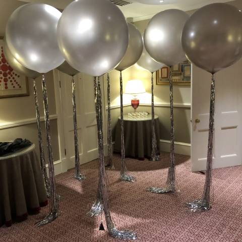 Silver balloons with silver tassles