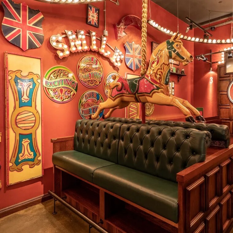 carousel horse in a fairground themed bar 