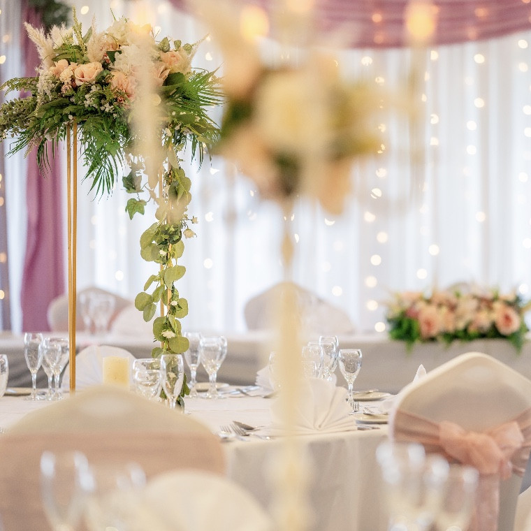 Wedding Styling with drapery Florals lighting and accessories. chair and table decor.