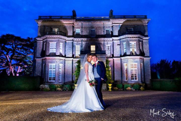 Hedsor House at dusk with the newlyweds