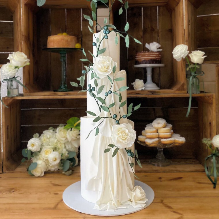 White Drape Wedding Cake with Sugar Olives