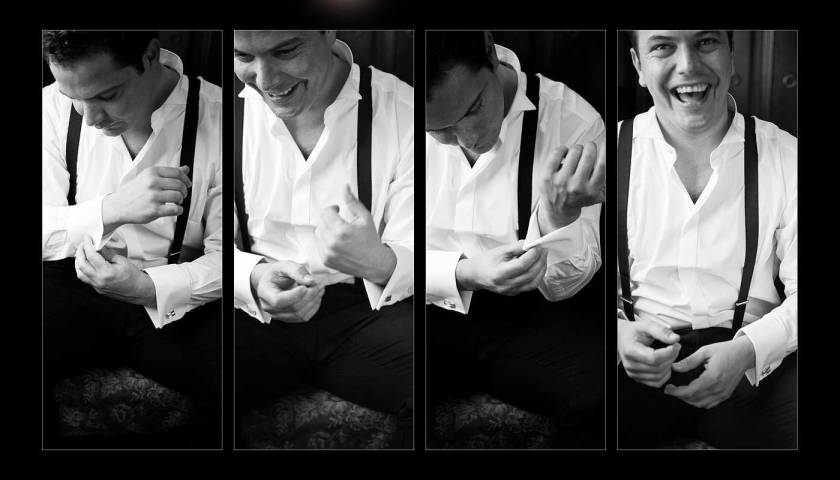 Groom getting ready fastening cufflinks