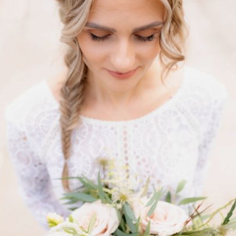 Elegant boho bride, the perfect combination of natural bridal makeup and a beautiful side braid hairstyle 