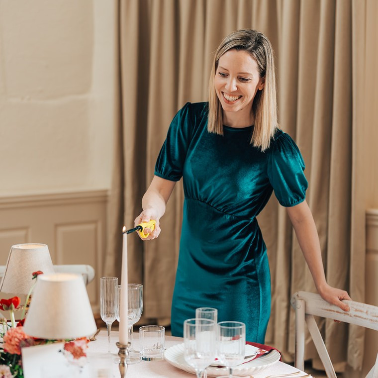 This is Kate, setting a beautiful tablescape for a wedding at Merriscourt