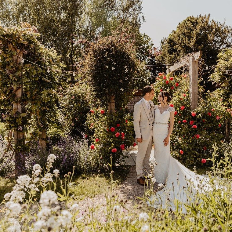 A beautiful June wedding at Field Place, surrounded by roses in the wedding garden