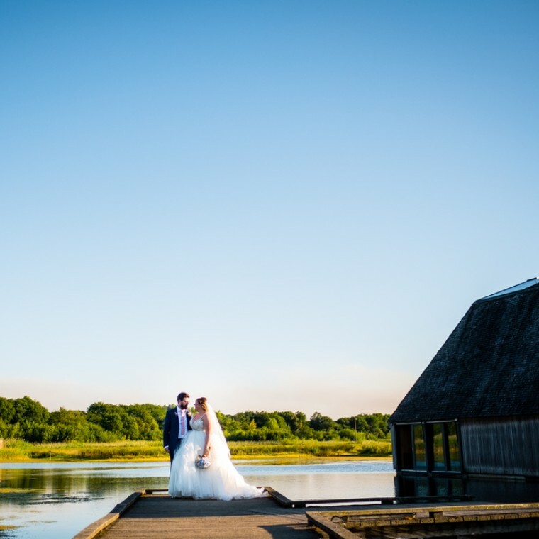 Bride and groom next to the water