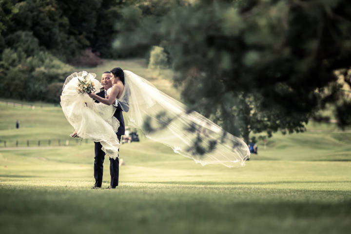 A bride being swept off her feet at Woldingham
