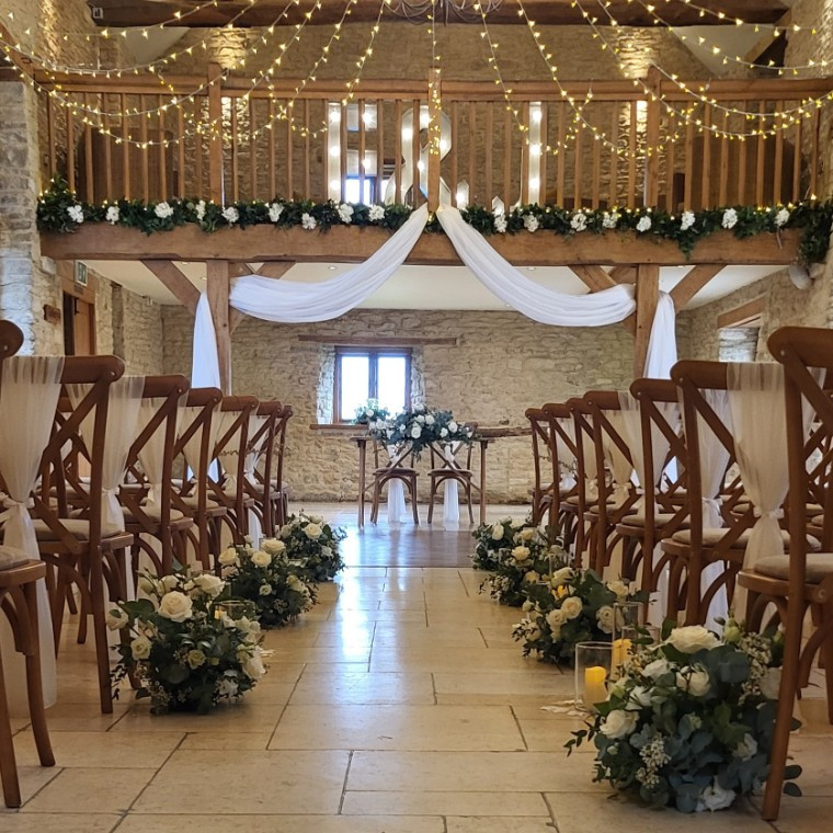 Kingscote Barn aisle decor, chair drapes and beam draping.