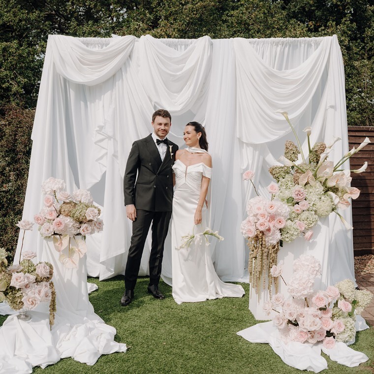 a couple posing on their wedding day 