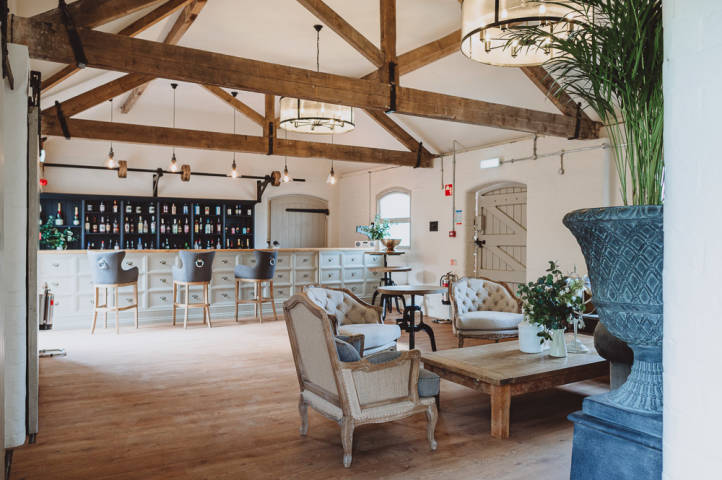 Renovated barn bar area with cream furnishings