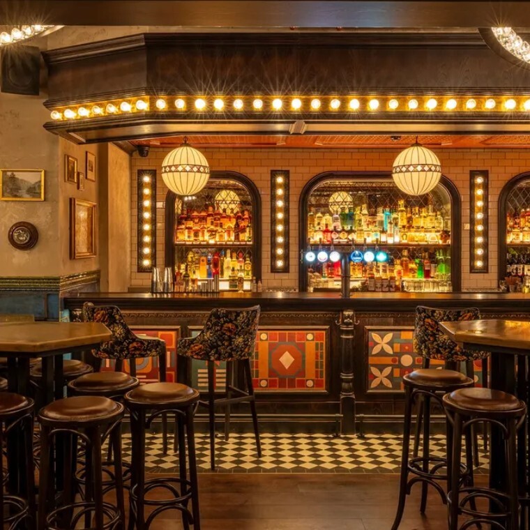 fairground themed bar with stained glass and tiles 