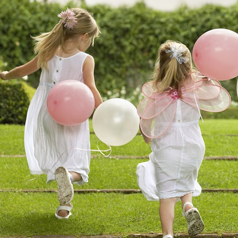 Children balloons playing at a wedding 