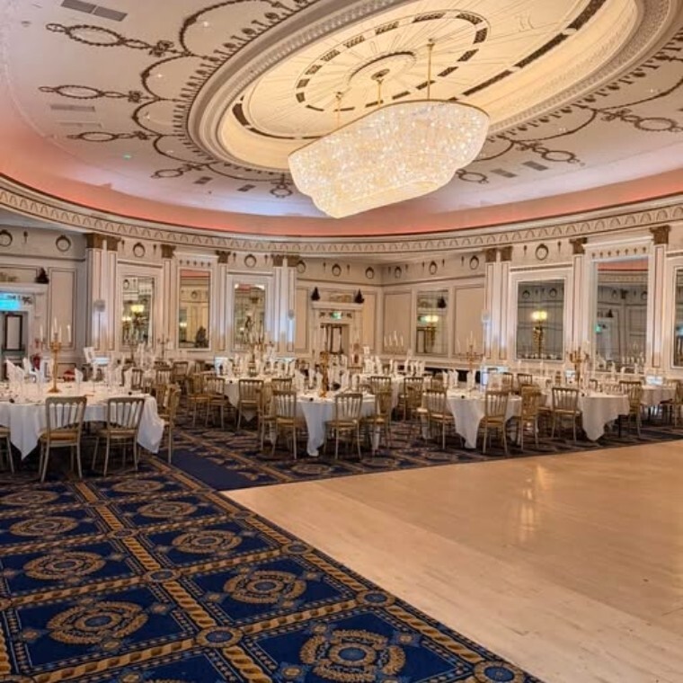 The Midland Hotel Room set for wedding dinner with beautiful chandelier and dance floor.