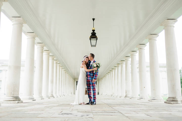 Queen's House, Greenwich, London, bride and groom embracing