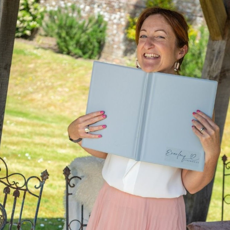 Everlong Ceremonies Jodie Watt Celebrant with folder cheeky smile